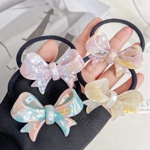 Set of four premium marble-texture acetate bow hair ties in assorted pastel colors