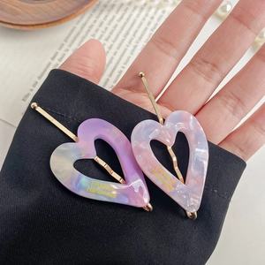 French retro heart acetate hair clips in purple and pink marble with gold lettering