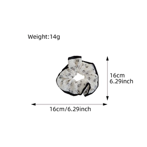 Floral scrunchie in beige tulle with black rose print and size dimensions 16cm