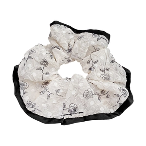 Elegant ivory floral scrunchie with black rose print and satin trim for women