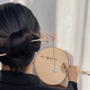 Classic Chinese style gold hair pin with pink plum blossom petals and pearl tassel
