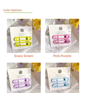 Détails des barrettes à cheveux macaron en vert, violet et bleu sur cartes vintage