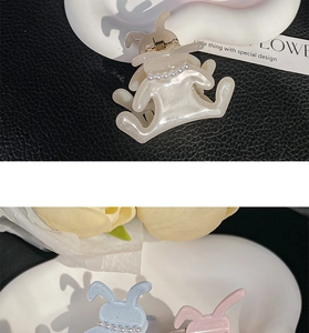 Detailed view of acetate bunny hair claws with pearl collar in cream, blue and pink