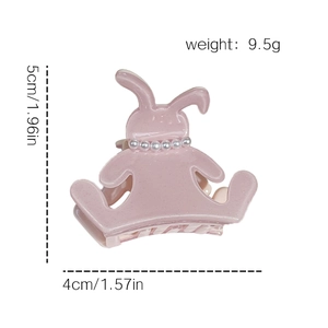 Cute pink acetate rabbit hair claw clip with pearl collar details and fine glitter finish