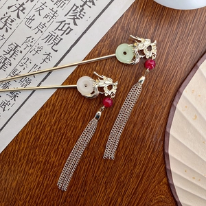 Elegant Chinese dragon hairpin with jade pendant and long tassels in a cultural setting