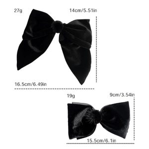 Elegant black velvet bow hair clips set with plush pom-poms for french style hair styling