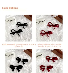 Detail view of velvet bow hair clips with pearls in red and black colors