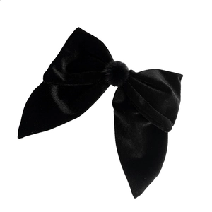 Elegant large black velvet bow hair clip with a soft pom-pom detail in French style