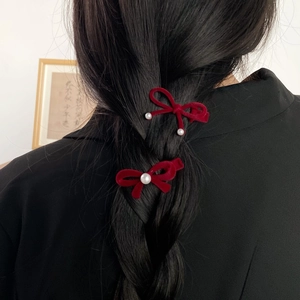 Elegant red velvet bow hair clips with pearls set of 2 styled on braided hair