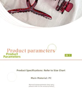 Detail of a large translucent deep red shark hair clip made of durable PC material