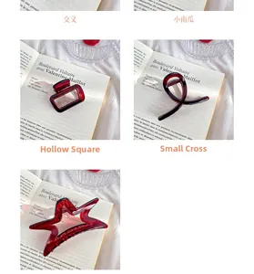 Detailed view of various burgundy resin hair claws in vintage French style shapes