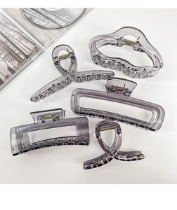 Set of five translucent smoke gray acrylic hair claws in various geometric shapes