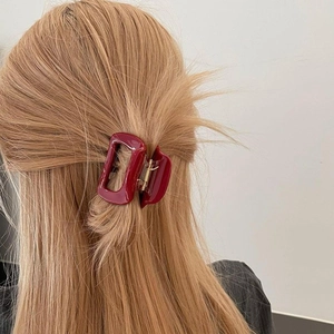 Large wine red square cutout hair claw clip shown on blonde hair for a minimalist look