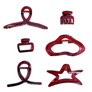 Set of six translucent deep red resin shark hair claws in assorted vintage shapes