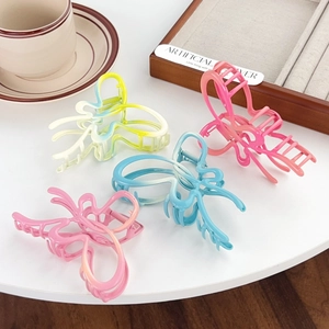 Elegant hollow butterfly hair claw clips in colorful gradient acrylic with metal spring