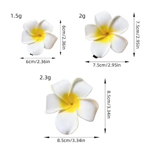 Three sizes of yellow frangipani flower hair clips with dimensions and weight chart