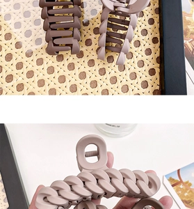 Detail of matte chain texture large claw clip in morandi brown and pink tones