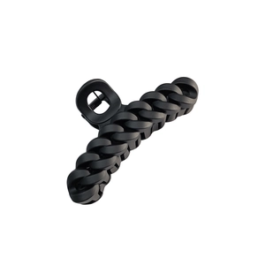 Matte black oversized chain link hair claw clip with a minimalist textured resin design