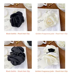 Detail of rose hair clip and pearl scrunchie made of premium satin fabric
