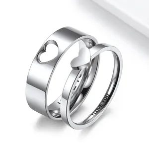 Polished stainless steel couple rings with cutout heart design and I LOVE YOU engraving