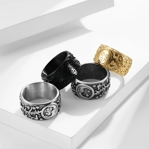 Detailed relief of sun and moon on vintage stainless steel rings in four metal finishes