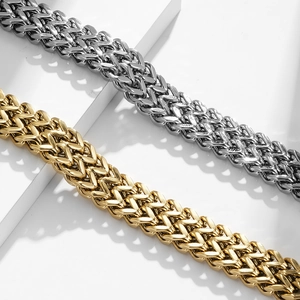Detail of gold and silver double-braided Franco chain bracelets with magnetic clasp