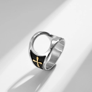 Detailed view of silver titanium steel bottle opener ring with gold cross and black enamel