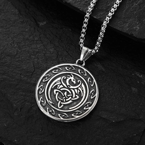 Vintage Viking Celtic dragon stainless steel pendant necklace on black stone background