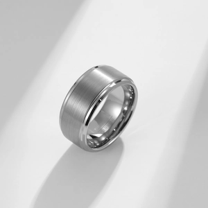 Macro detail of brushed matte tungsten carbide ring with polished beveled edges