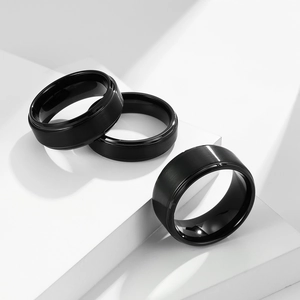 Matte brushed black tungsten ring for men with polished inner band on geometric blocks