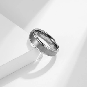 Minimalist brushed tungsten carbide ring with polished edges and inner engraving