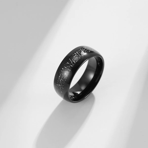 Polished black tungsten steel ring with a unique silver-gray meteorite texture inlay