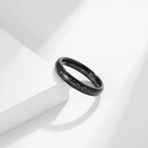 Minimalist tungsten carbide ring with silver crackle pattern on a white geometric block