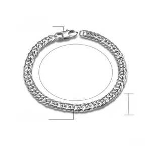 Macro detail of 6mm wide Cuban link chain bracelet in polished stainless steel
