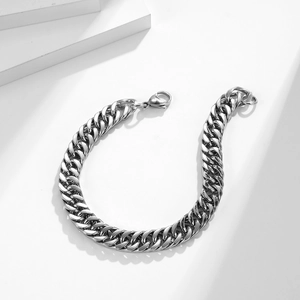 Bracelet gourmette poli en acier inoxydable avec grand fermoir homard sur cubes blancs