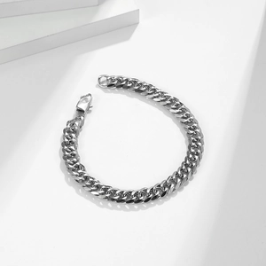 Detailed view of silver stainless steel Cuban link bracelet with classic lobster clasp