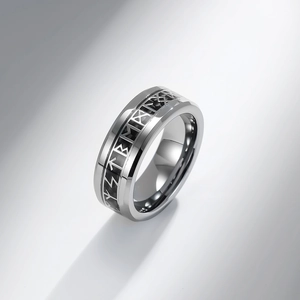 Detailed view of Nordic Viking rune engraving on silver tungsten steel ring with shadows