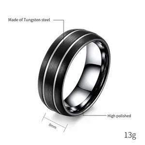 Detailed view of 8mm brushed black and gold tungsten ring with twin parallel stripes