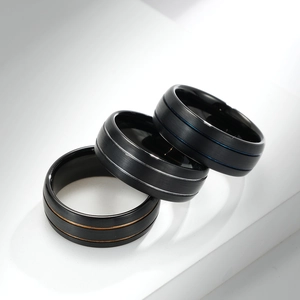 Matte black tungsten rings with dual grooves in gold, silver, and blue finishes