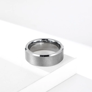 Minimalist brushed tungsten steel ring with silver matte finish and polished bevel edges