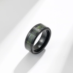 Men's tungsten ring featuring green carbon fiber and silver celtic dragon inlay pattern