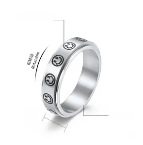Close-up of a 6mm rotatable stainless steel smiley face anxiety ring with 5g weight info