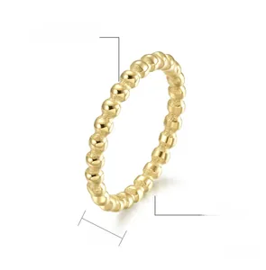 Detail of 3mm beaded stainless steel ring with a high polished gold finish texture