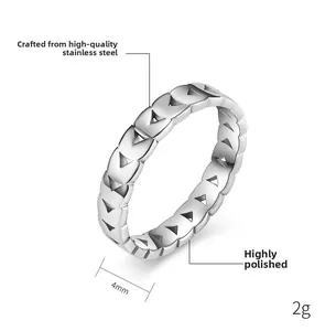 Macro detail of 4mm stainless steel ring with geometric triangle pattern and polished finish