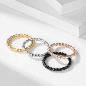 Minimalist stackable stainless steel bead rings in gold, silver, rose gold and black colors