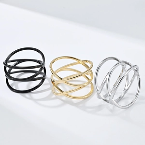 Set of three hollow interlaced stainless steel rings in black, gold, and silver finishes
