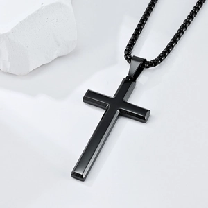 Minimalist black stainless steel cross pendant necklace with a sleek beveled edge design