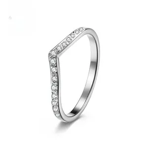 Macro detail of V-shaped rotating spinner ring with circular row of inlaid zircons