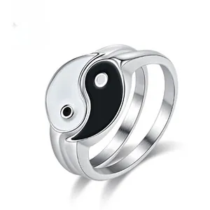 Detail of a rotating stainless steel ring with a black and white Yin Yang Tai Chi symbol