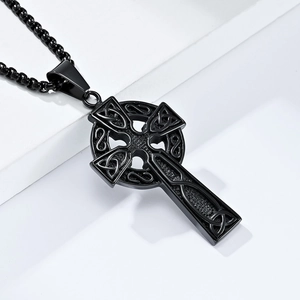 Vintage black Celtic knot cross pendant necklace in stainless steel on white pedestal